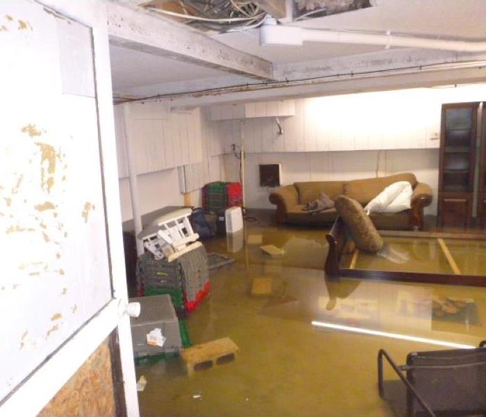 Flooding in basement, furniture in standing water